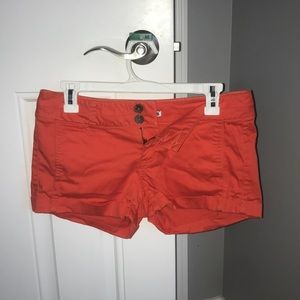 Coral shorts.